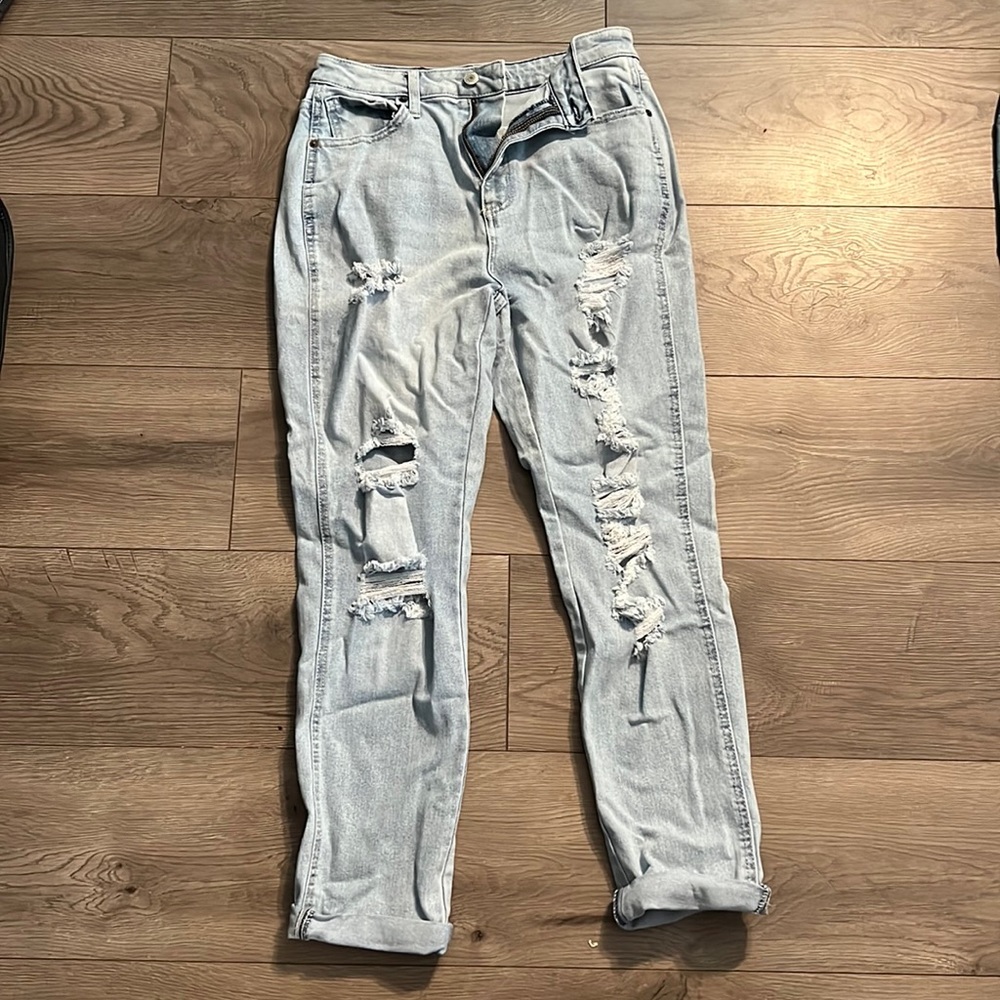 Ripped light washed blue jeans, size 7.